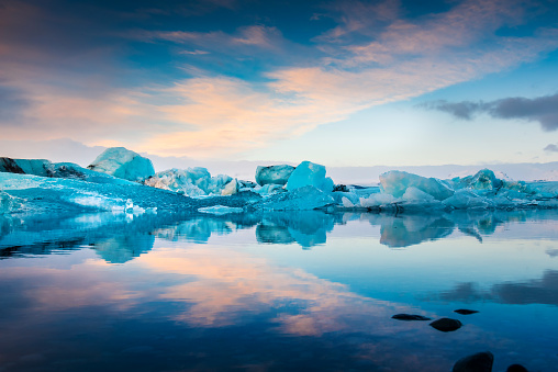 Jokulsarlon Glacier Lagoon in Iceland at sunset ice reflected on the glacial calm water