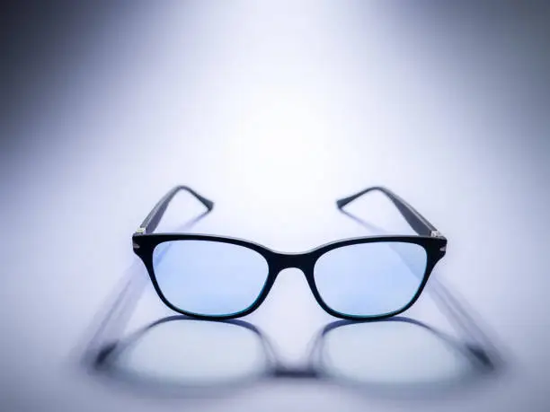 Photo of Blue light blocking glasses. Black frame glasses for filtering blue light from the computer. Prevent Computer Vision Syndrome. Eye protection