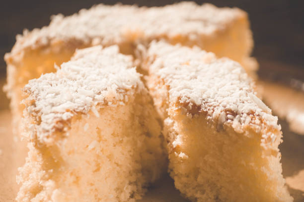 istock Coconut cake sliced in brown dish on wooden table. Focus seletive 1227552972