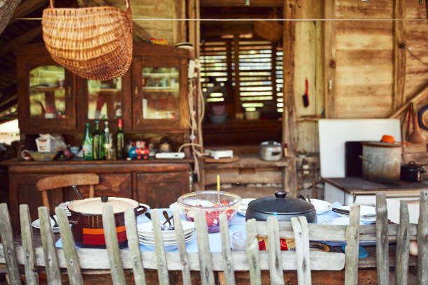 istock Rustic cottage with outdoor kitchen table ready for summertime lunch. 1227554637