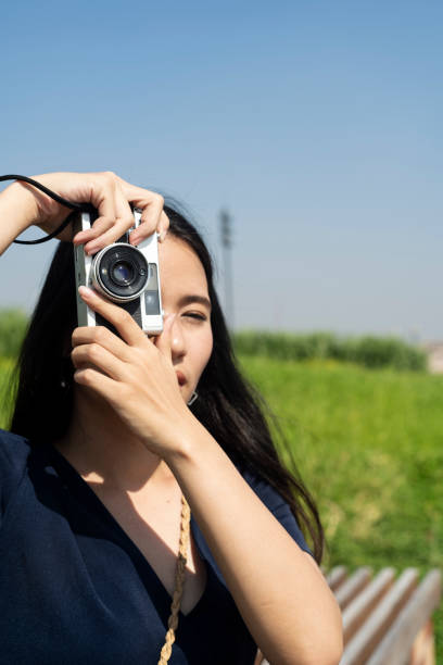istock Long hair woman and her camera. 1227556994