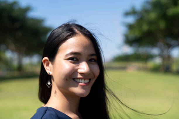istock Smiling woman in windy day. 1227557577