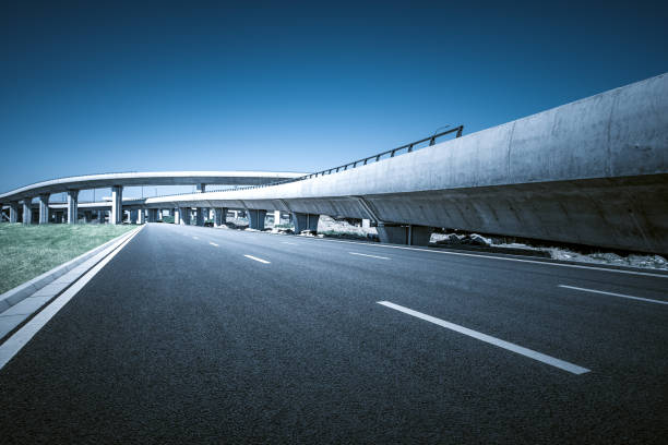 istock Clear blue sky and white clouds in the background, highway overpass curved approach bridge 1227558453