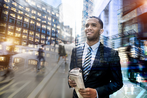 Portrait of a successful African American business man working in the global stock market - double exposure concepts