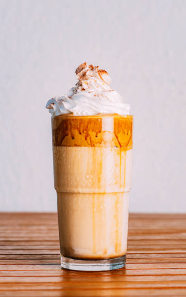 istock Delicious Chocolate Milkshake on Wooden Background 1227558982