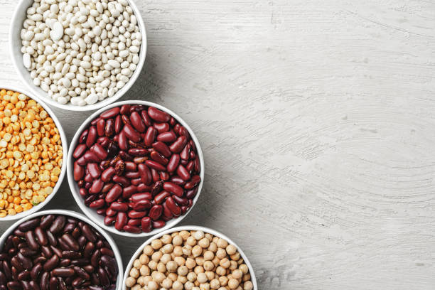istock Beans assortment on white stone table, close up. 1227560624