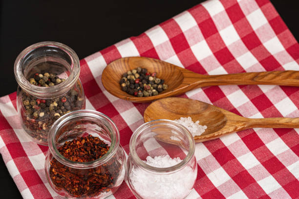 Set of spices on a kitchen counter close up Set of spices for cooking on a kitchen counter close up spice rack stock pictures, royalty-free photos & images
