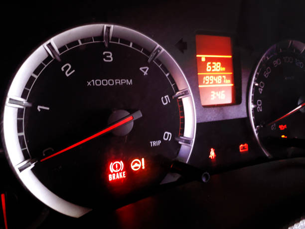 istock Dashboard of a car in night with speedometer and fuel indicator glowing red light 1227562876