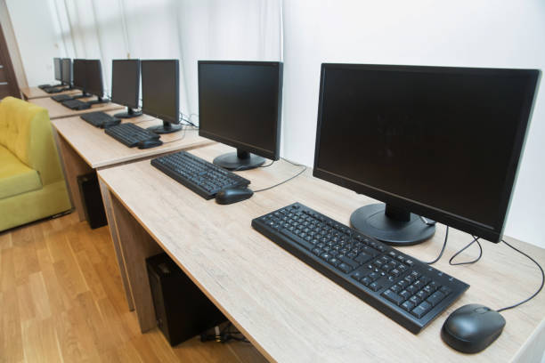 istock two computers and a desk . Keyboard and mouse . Two computer monitors with a black screen on a desk . 1227565319