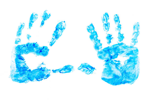 istock multicolored prints of children's hands  on white background. Abstract painted background. Children's art and painting. 1227565529