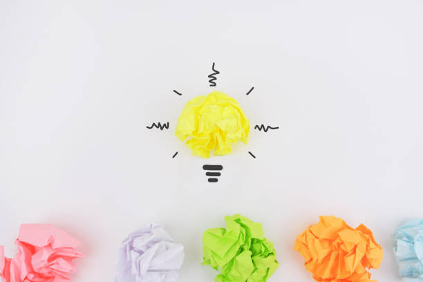 istock Uniqueness concept, creative idea with crumpled paper light bulbs. 1227568396