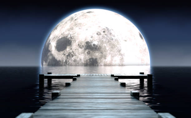 istock Pier and Moon On Water Horizon 1227568851