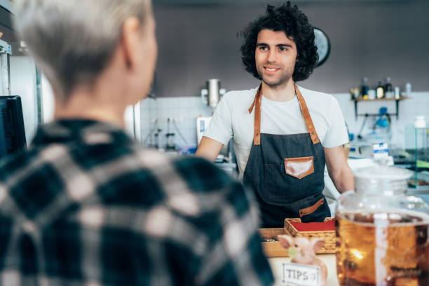 istock Barista and female customer 1227569282