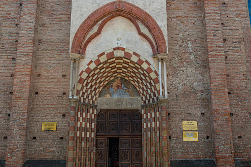 Alba, Piedmont, Italy - 17 June 2017: Entrance door of the Church San Domenico in the historic city of Alba