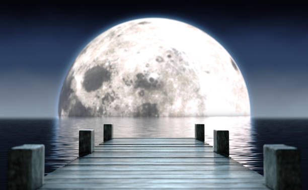 istock Pier and Moon On Water Horizon 1227570311