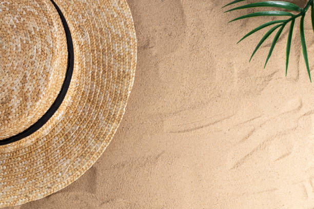 istock Summer vacation composition. Hat on sand background with a copy of space. Summer background 1227571221