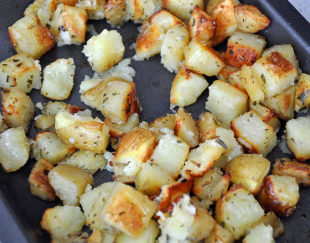 istock Cooked parmentier potatoes in a grey metal serving dish. Close up 1227571648