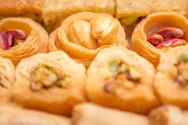 istock Turkish Ramadan Dessert Baklava, Ice Cream Presented, White Background. Baklava background. Delicious dessert baklava with nuts filling 1227573711