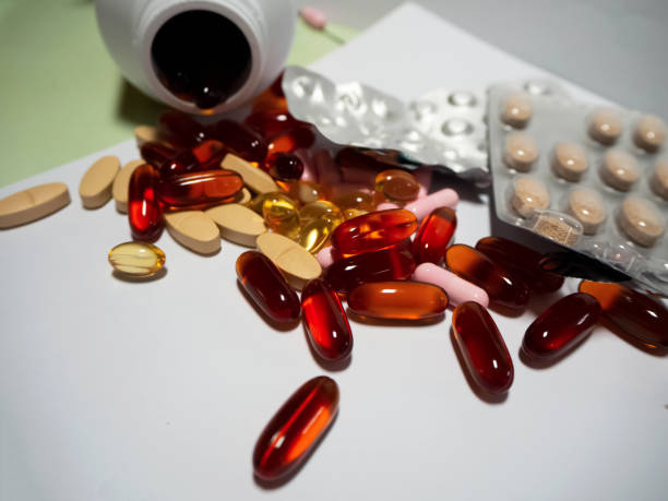 istock Medicine pills,tablets and capsule plenty on background 1227573911