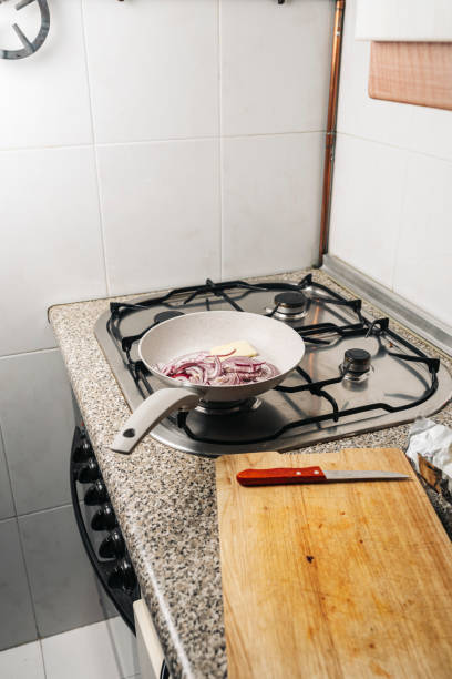 istock skillet with chopped red onion and butter on the kitchen fire 1227575279