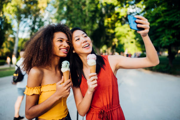 istock Girls eating ice cream and vlogging 1227575360