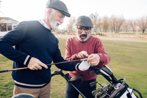 istock Two senior men talking about the golf club and enjoying 1227575450