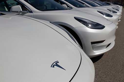 Indianapolis - Circa April 2020: Tesla electric vehicles awaiting preparation for sale. Tesla EV Model 3, S and X are a key to a cleaner and greener environment.