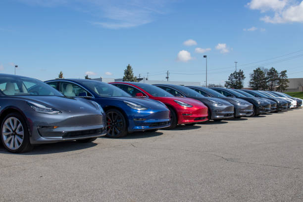 Tesla electric vehicles awaiting preparation for sale. Tesla EV Model 3, S and X are a key to a cleaner and greener environment. Indianapolis - Circa April 2020: Tesla electric vehicles awaiting preparation for sale. Tesla EV Model 3, S and X are a key to a cleaner and greener environment. tesla model x stock pictures, royalty-free photos & images