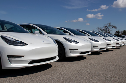 Indianapolis - Circa April 2020: Tesla electric vehicles awaiting preparation for sale. Tesla EV Model 3, S and X are a key to a cleaner and greener environment.