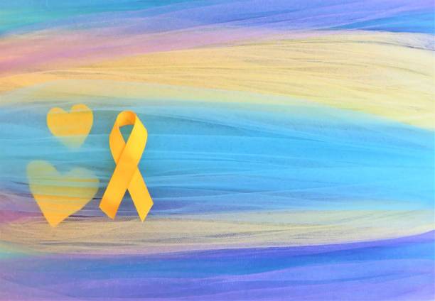 Yellow ribbon--Awareness month: Suicide; Endometriosis; Military; Firefighters Yellow ribbon, hearts--Awareness month: suicide; military; firefighters. Announcement. Fabric Art & Craft Background. Copy space. christine kohler stock pictures, royalty-free photos & images