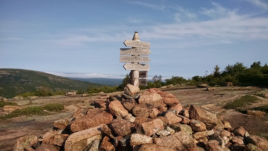 Summer hike - trail sign pointing to Cadillac South Ridge trail, Cadillac Mountain, and Blackwood's Campground