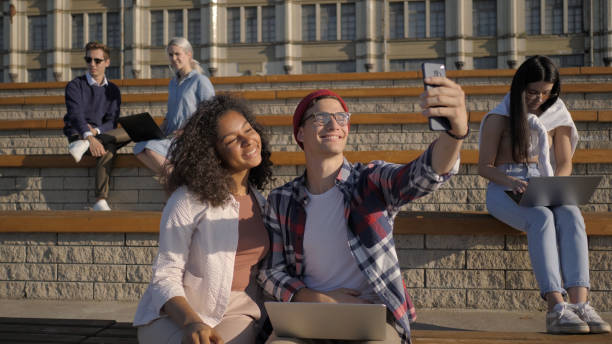 istock Group of students in front of university taking selfie 1227578820