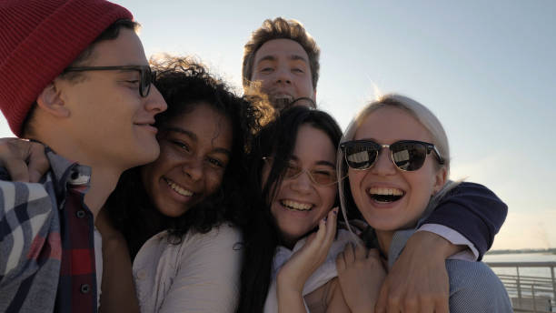 istock Smiling students taking selfie in the summer sun 1227578962