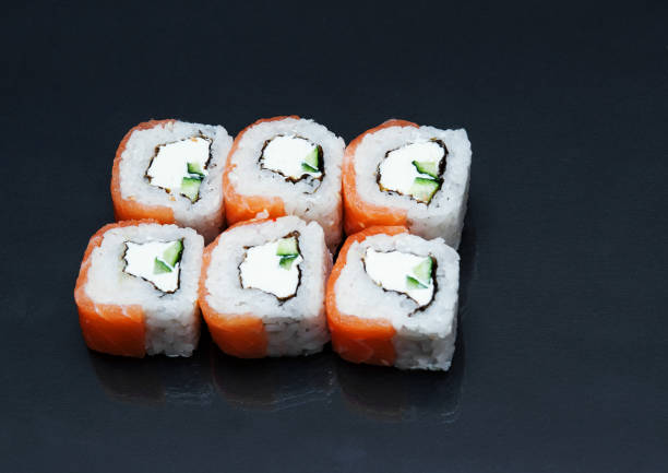 istock Sushi on stone dark background. 1227579160