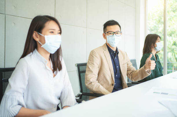 istock Business people working with face mask. 1227582667