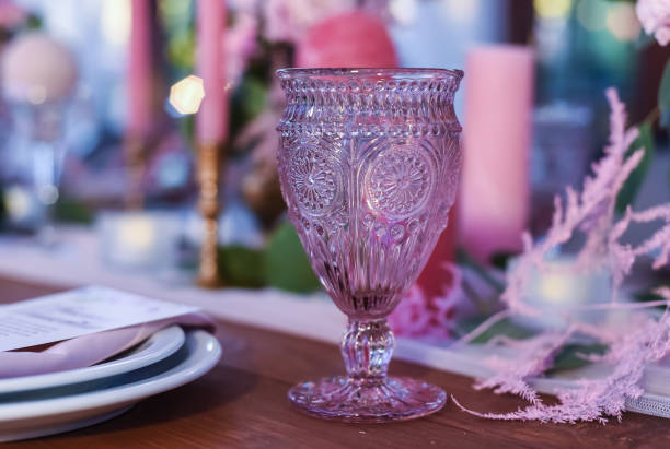 istock Decorative wine glass for wine from pink glass. Holidays ware 1227583061