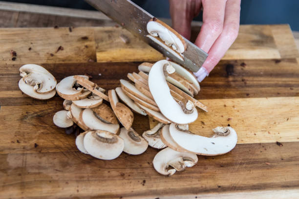 istock Cutting mushrooms in the kitchen 1227583115