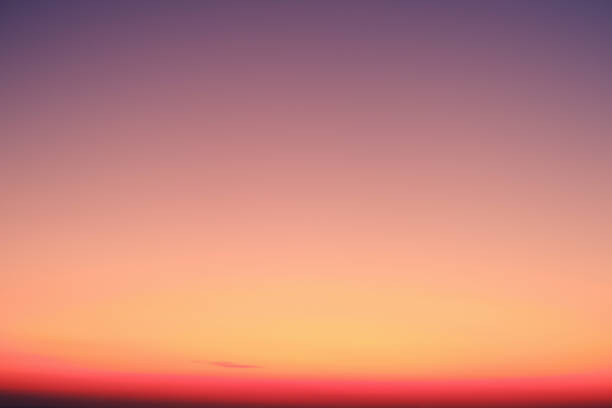 istock Sky gradient from purple to pink at sunset 1227584157