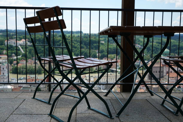 This are benches and chairs at tables invite you to relax and unwind