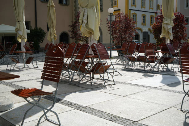 istock Benches and chairs at tables invite you to relax and unwind 1227587933