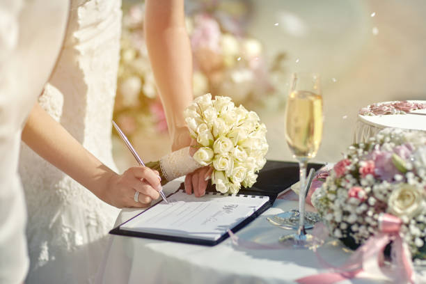 istock The bride at the ceromony signs a document 1227587989