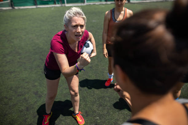 istock Team captain having motivational talk before game on soccer field 1227588353