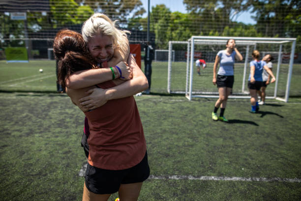 istock Teammates celebrating winning a match on soccer field 1227589182