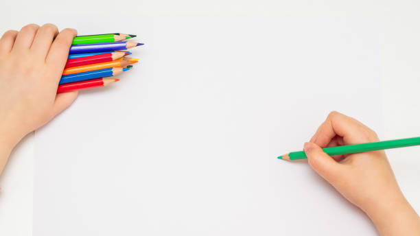 istock Child is drawing by colored pencils. 1227589863
