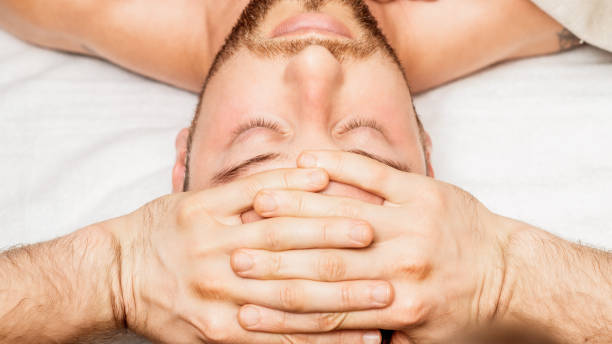istock Man receiving relaxing head massage. 1227590284