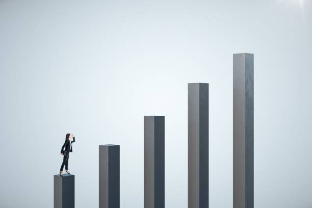 istock Businesswoman standing on stock chart 1227591736