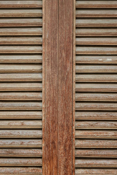 Old vintage brown wood louver window stock photo