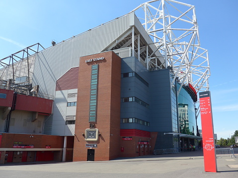 The side view of Old Trafford Stadium of Manchester United England football club. The stadium is now empty because of the COVID-19 disease