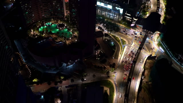 4K Aerial footage of traffic as seen from skyscraper on the jam modern city street. Transportation and public transport concept night video.
