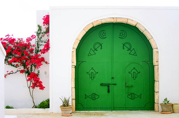 Entrance Green gate in Arabic style. djerba stock pictures, royalty-free photos & images